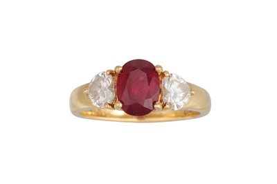 Lot 303 - A RUBY AND DIAMOND THREE STONE RING, the oval...