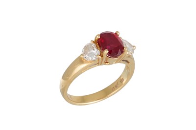 Lot 118 - A RUBY AND DIAMOND THREE STONE RING, the oval...