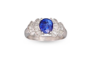 Lot 200 - A SAPPHIRE AND DIAMOND RING, the oval sapphire...