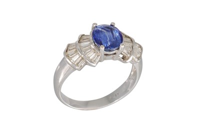 Lot 304 - A SAPPHIRE AND DIAMOND RING, the oval sapphire...