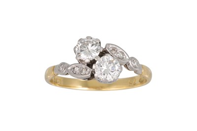 Lot 339 - A VINTAGE TWO STONE DIAMOND RING, of cross...