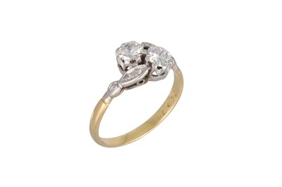 Lot 339 - A VINTAGE TWO STONE DIAMOND RING, of cross...