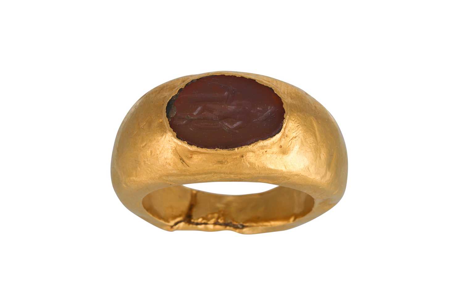 Lot 198 - A ROMAN CARNELIAN AND GOLD FINGER RING, circa...
