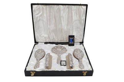 Lot 426 - A MODERN CASED SILVER EMBOSSED DRESSING TABLE...