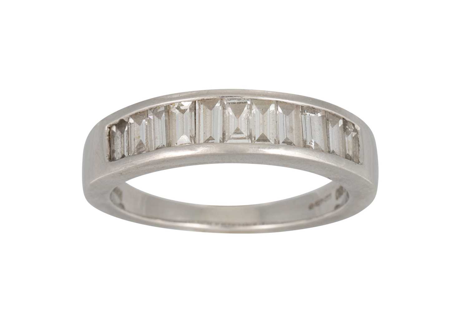 Lot 9 - A DIAMOND HALF ETERNITY RING, channel set with...