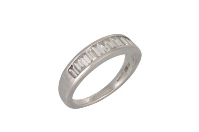 Lot 342 - A DIAMOND HALF ETERNITY RING, channel set with...