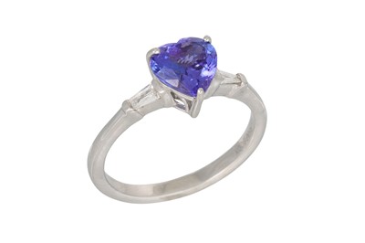 Lot 16 - A TANZANITE RING, heart shaped stone to a...