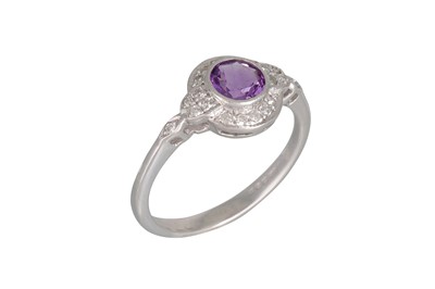Lot 4 - AN AMETHYST AND DIAMOND CLUSTER DRESS RING,...