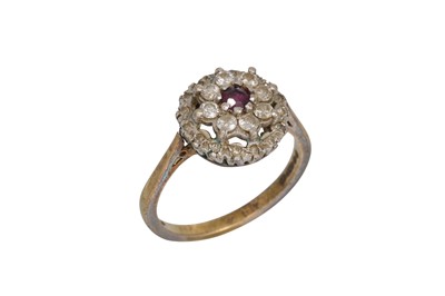 Lot 58 - A RUBY AND DIAMOND CLUSTER DRESS RING, mounted...