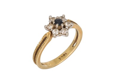 Lot 61 - A DIAMOND AND SAPPHIRE CLUSTER RING, mounted...