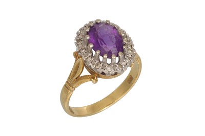 Lot 62 - AN AMETHYST AND DIAMOND CLUSTER RING, mounted...