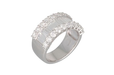 Lot 158 - A DIAMOND SET THREE ROWED RING, the baguette...