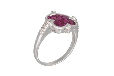 Lot 160 - A RUBY AND DIAMOND CLUSTER RING, the princess...