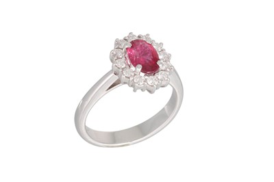 Lot 198 - A RUBY AND DIAMOND CLUSTER RING, the oval ruby...