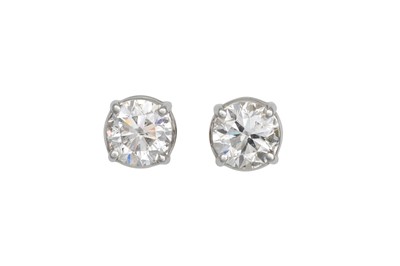 Lot 200 - A PAIR OF DIAMOND STUD EARRINGS, the round...