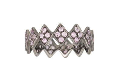 Lot 213 - A RUBY SHAPED BAND RING, in zig-zag form,...
