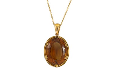 Lot 94 - A LARGE OVAL CITRINE PENDANT, mounted on 18ct...