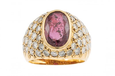 Lot 238 - A RUBY AND DIAMOND RING, the oval ruby to a...