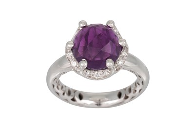 Lot 247 - AN AMETHYST AND DIAMOND DRESS RING, the mixed...