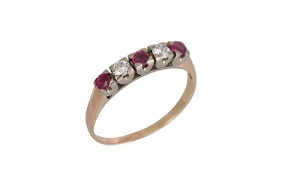 Lot 325 - A RUBY AND DIAMOND FIVE STONE RING, the...