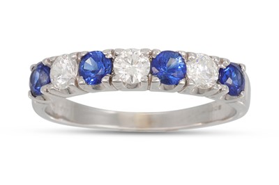 Lot 88 - A DIAMOND AND SAPPHIRE SEVEN STONE RING,...