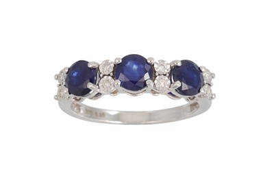 Lot 221 - A SAPPHIRE AND DIAMOND RING, the circular...