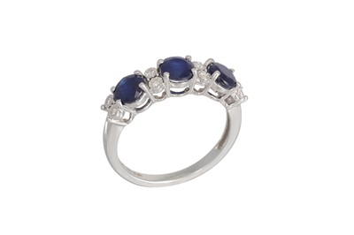 Lot 221 - A SAPPHIRE AND DIAMOND RING, the circular...