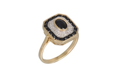 Lot 36 - A DIAMOND AND SAPPHIRE CLUSTER RING, octagonal...