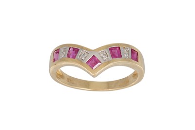Lot 38 - A DIAMOND AND RUBY ETERNITY RING, the  shaped...