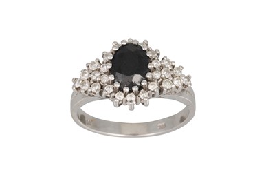 Lot 89 - A DIAMOND AND SAPPHIRE CLUSTER RING, the...