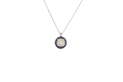 Lot 289 - A DIAMOND AND SAPPHIRE CLUSTER PENDANT, of...
