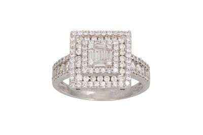 Lot 373 - A DIAMOND CLUSTER RING, set with baguette and...