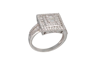 Lot 373 - A DIAMOND CLUSTER RING, set with baguette and...