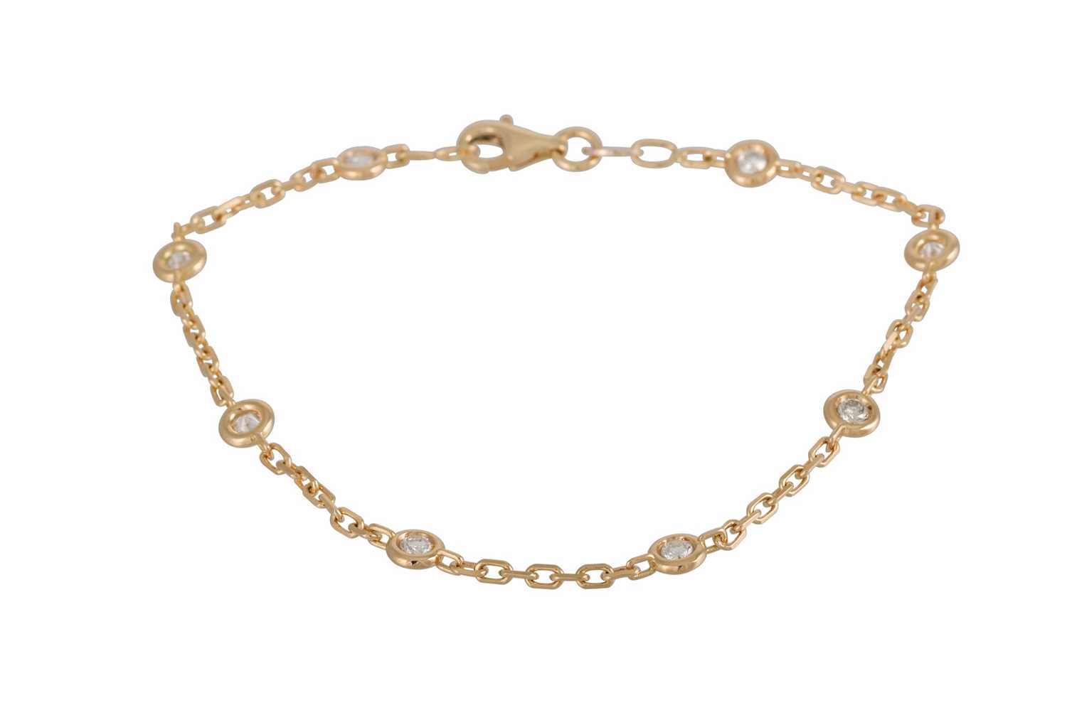 Lot 389 A DIAMOND BRACELET, the collet set brilliant