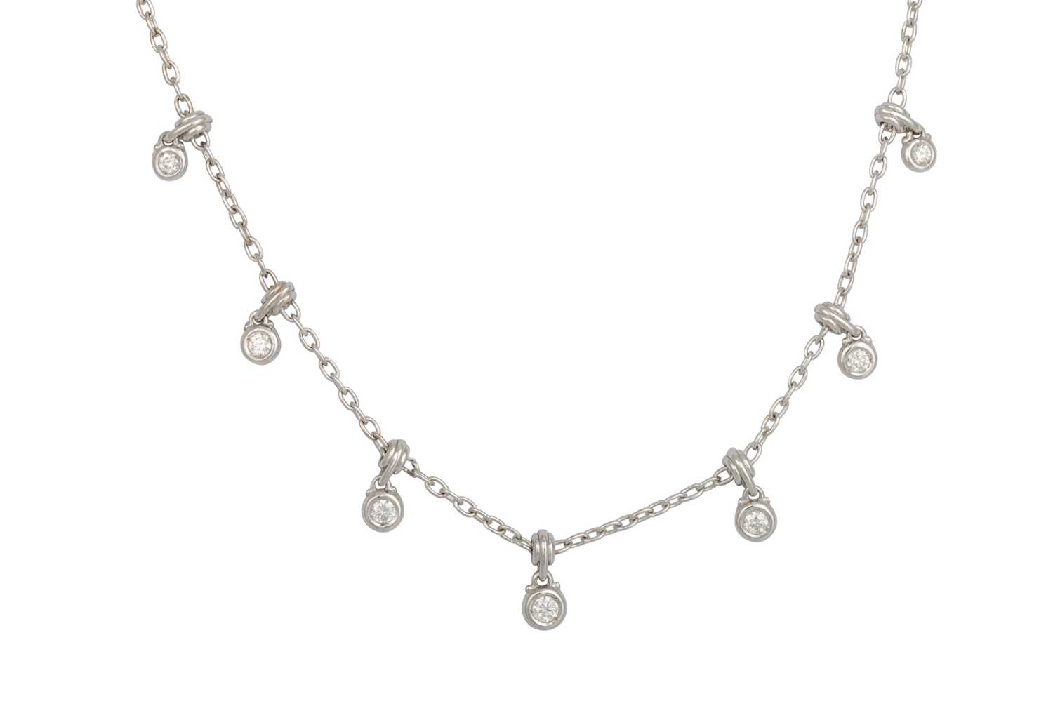 Lot 390 - A DIAMOND NECKLACE, the collet set diamonds...