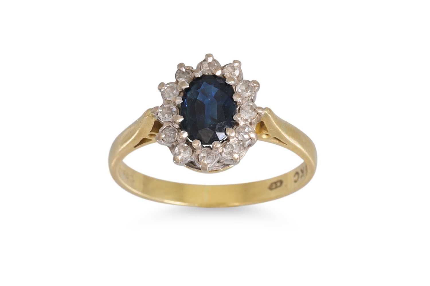 Lot 59 - A DIAMOND AND SAPPHIRE CLUSTER RING, of oval...