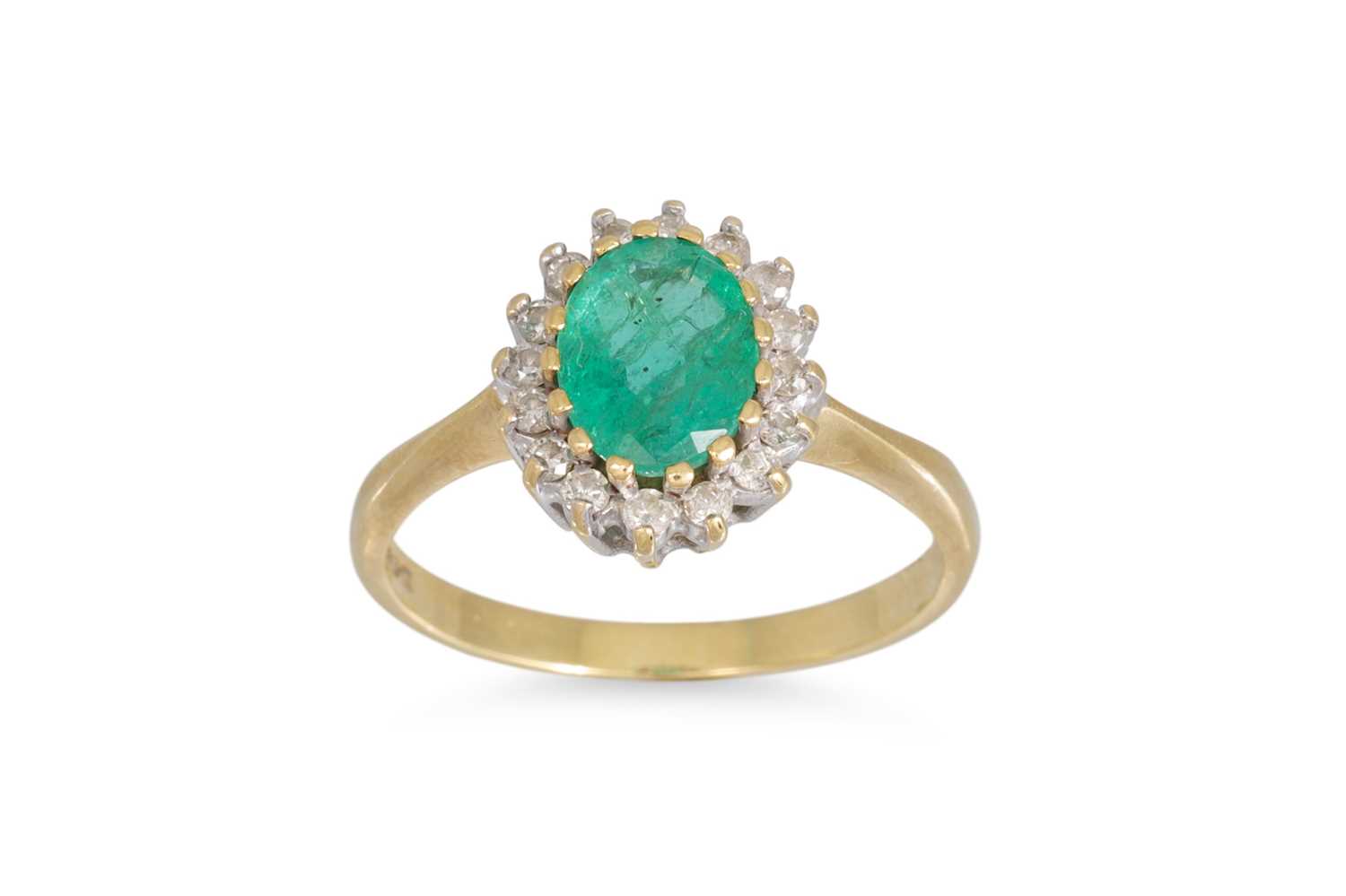 Lot 60 - A EMERALD AND DIAMOND CLUSTER RING, of oval...
