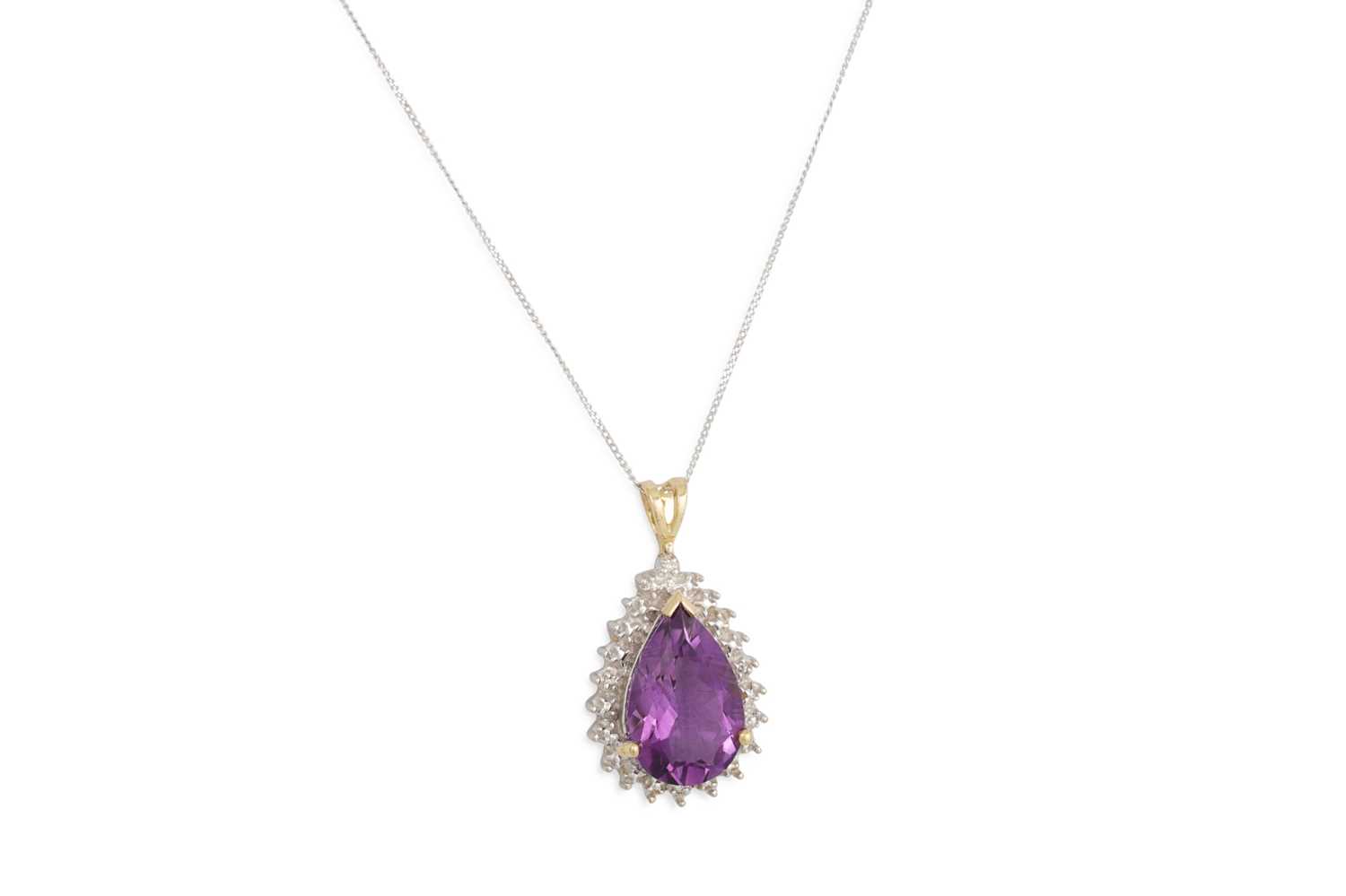 Lot 45 - A DIAMOND AND AMETHYST PENDANT, the large pear...