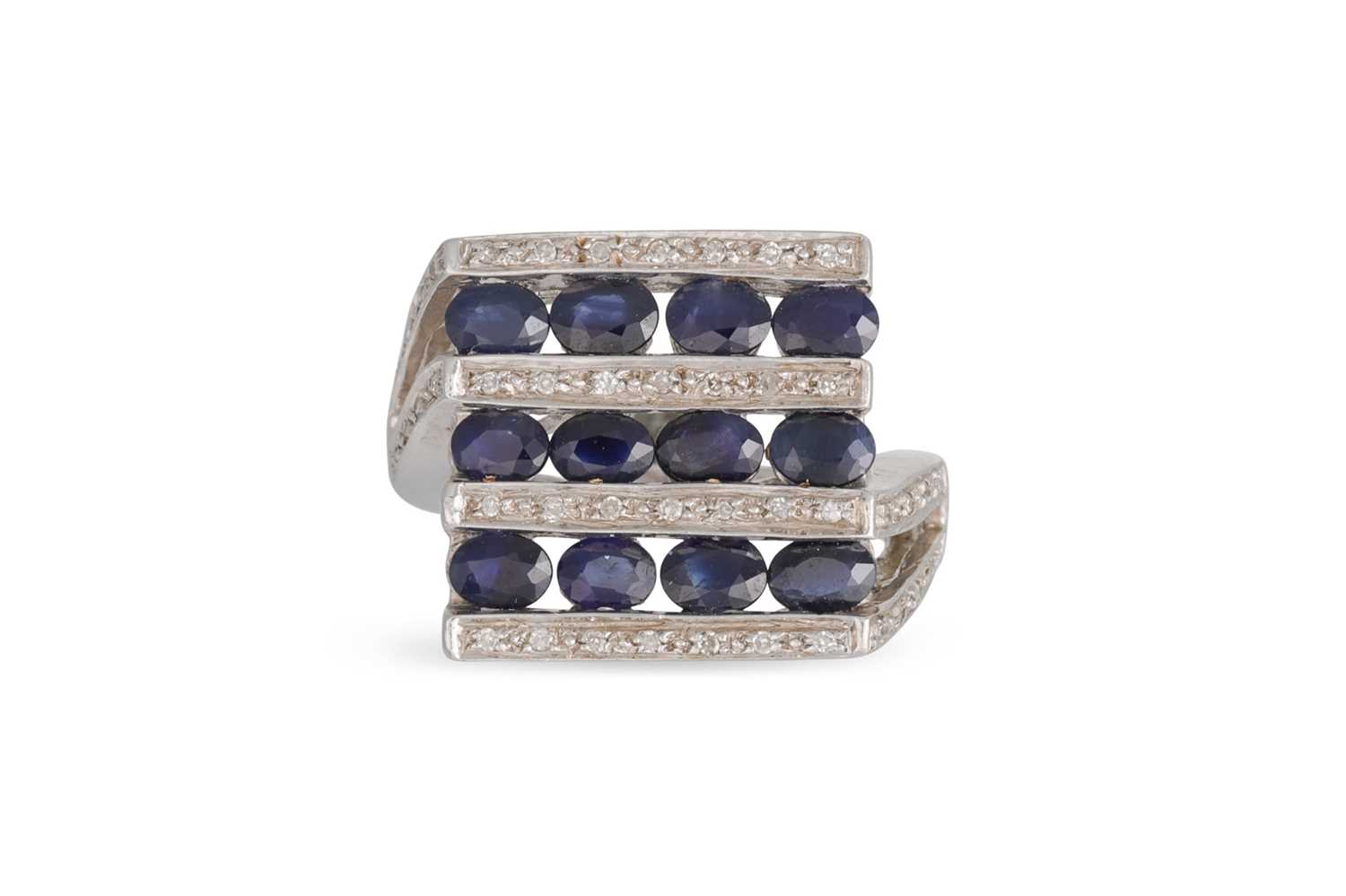 Lot 52 - A DIAMOND AND SAPPHIRE CLUSTER RING, set with...