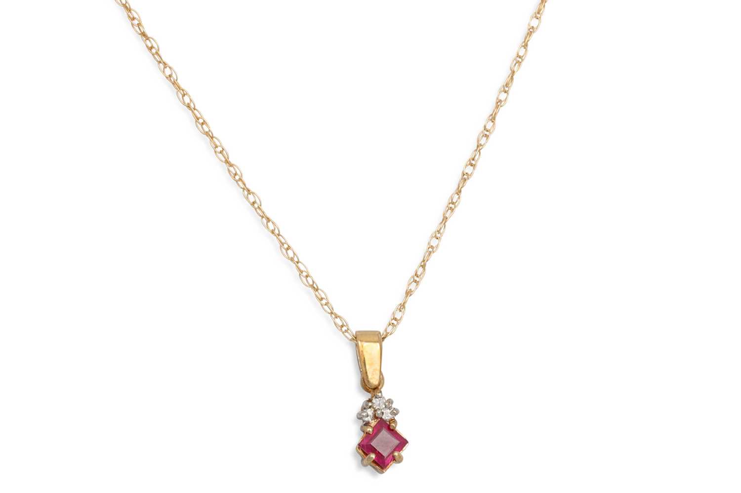 Lot 210 - A RUBY AND DIAMOND SET PENDANT, mounted in 9ct...