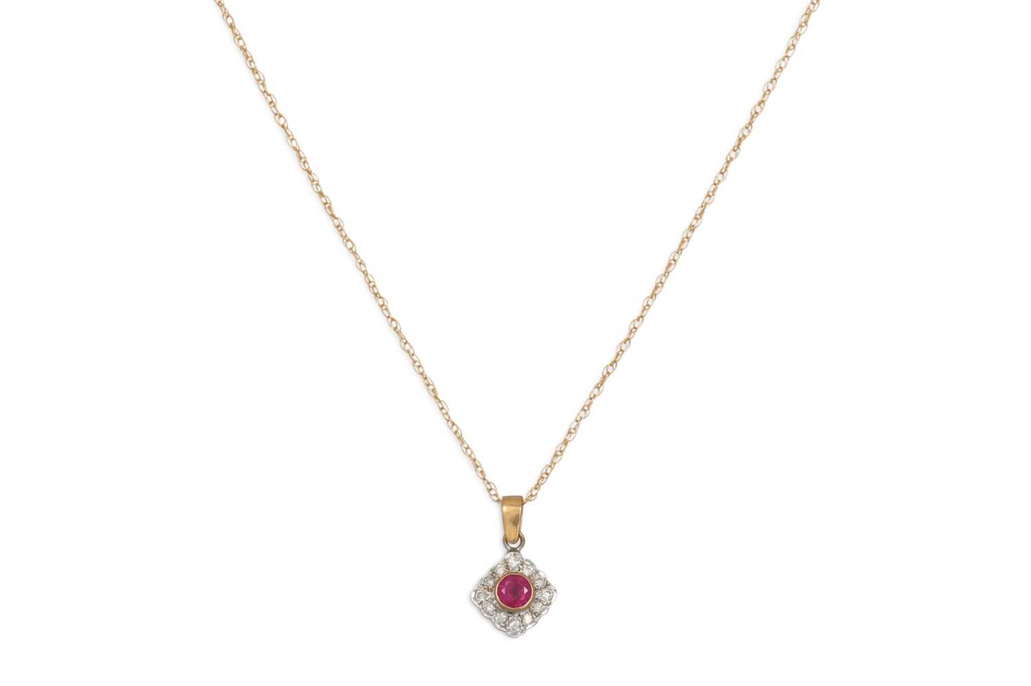 Lot 211 - A RUBY AND DIAMOND CLUSTER PENDANT, on a 9ct...