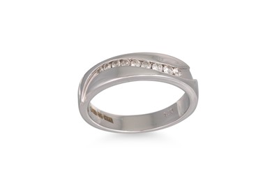 Lot 13 - A CHANNEL SET DIAMOND RING, mounted in 9ct...