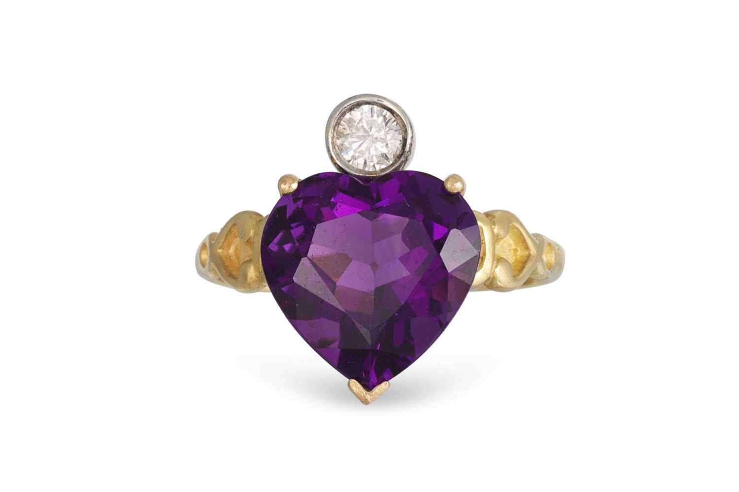 Lot 149 - A DIAMOND AND AMETHYST RING, set with a heart...