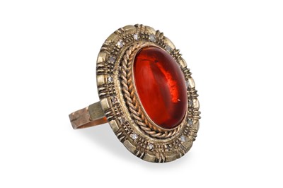 Lot 321 - A VINTAGE GEM SET RING, the oval cabochon to a...