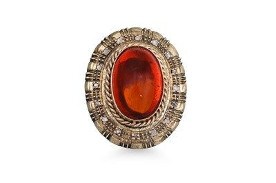 Lot 321 - A VINTAGE GEM SET RING, the oval cabochon to a...