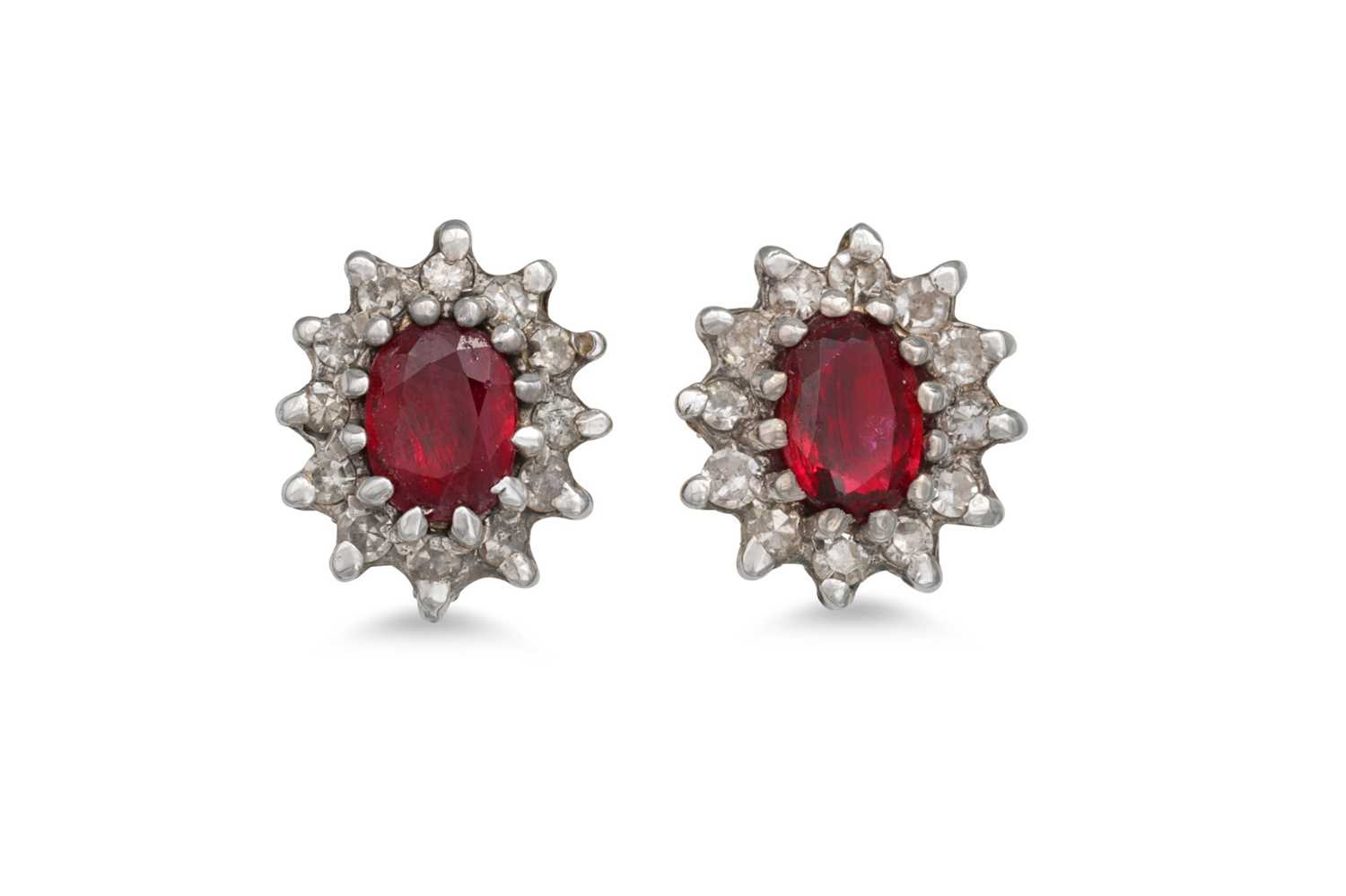 Lot 52 - A PAIR OF RUBY AND DIAMOND EARRINGS, of oval...