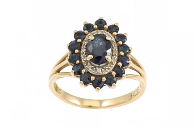 Lot 56 - A DIAMOND AND SAPPHIRE CLUSTER RING, of oval...