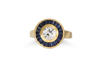 Lot 216 - A DIAMOND AND SAPPHIRE TARGET RING, the...
