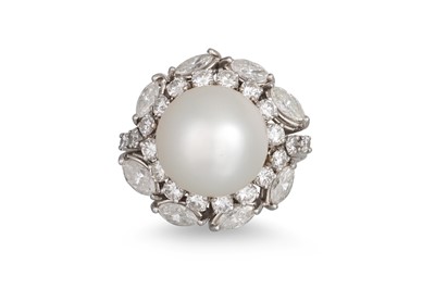 Lot 312 - A PEARL AND DIAMOND CLUSTER RING, the central...