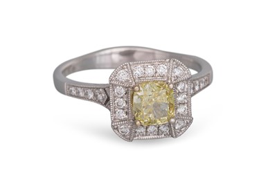 Lot 314 - A DIAMOND RING, the fancy yellow centre...
